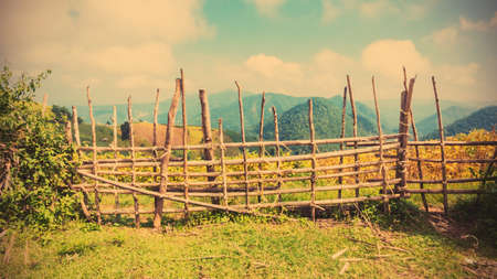 Handmade tempolary bamboo fence on the mountain, vintage filter effectの写真素材