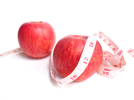 Red apple and measuring tape.Healthy and diet conceptの写真素材