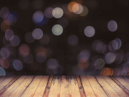 wooden floor over light bokeh background with vintage filter effect