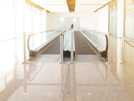 Moving walkway or escalator in exhibition hall building.