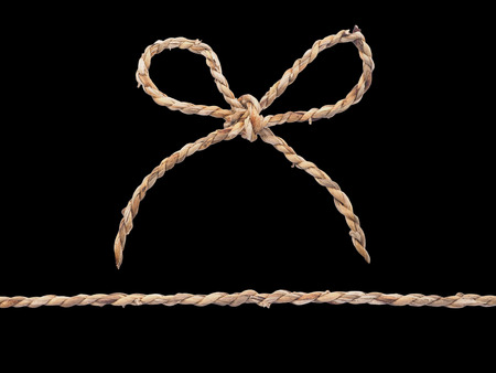 Close up rope bow isolated on black backgroundの写真素材