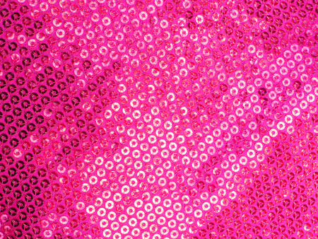 Pink sequins embroidered on pink fabric,backgroundの写真素材