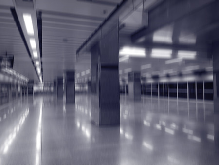Blurry abstract interior of empty dark subway station for Halloween background
