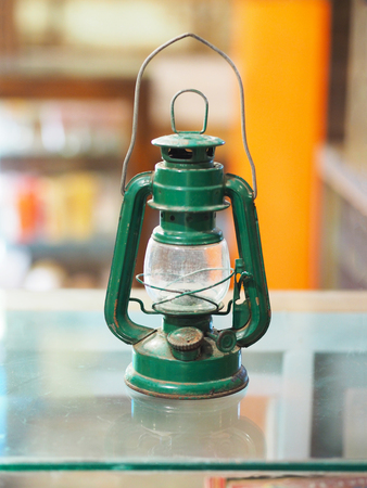 Close up green vintage lamp light on glass.の写真素材