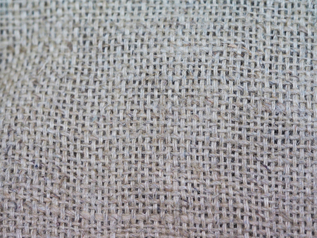 Close up rough sackcloth fabric background, selective focus.の写真素材