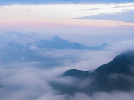 Abstract background of soft foggy motion at the top of mountain with sunset sky in the evening.の写真素材