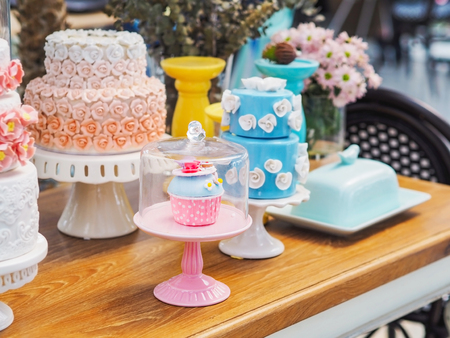 Close up colorful fancy cake on white cakestand for birthday, wedding or party decoration.