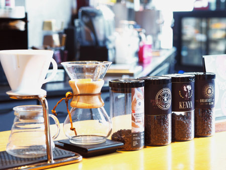 CHONGQING, CHINA - DECEMBER 09,2019 , Close up bottles of coffee bean and dripper on wooden table at Starbucks coffee shop.のeditorial素材