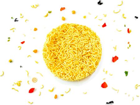 Top view of instant dry noodles round shape and small ingredients on white background.の写真素材