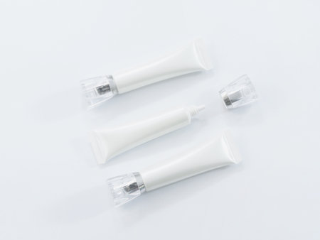 Close up white cosmetic tubes over white background. Beauty product.の写真素材