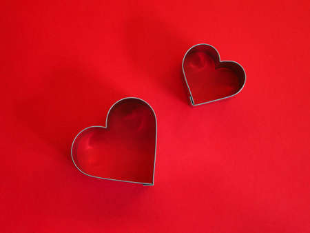 Close up heart shape on red color. Love concept for Valentine day background.