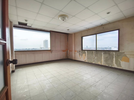 Interior office under construction and unfinished. Empty shabby room before renovation.の写真素材