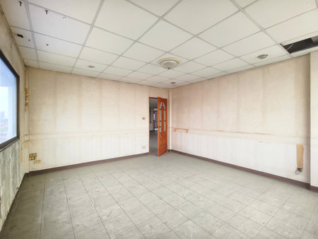 Interior office under construction and unfinished. Empty shabby room before renovation.の写真素材