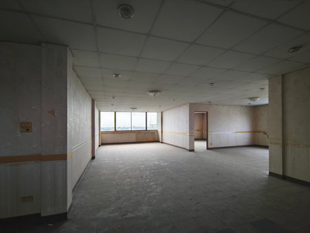 Interior office under construction and unfinished. Empty shabby room before renovation.の写真素材