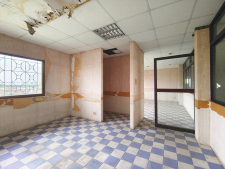 Interior office under construction and unfinished. Empty shabby room before renovation.の写真素材