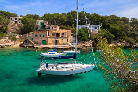 Yacht boats anchored in beautiful bay near small fishing village of Cala Figuera on Majorca island, Spainの写真素材