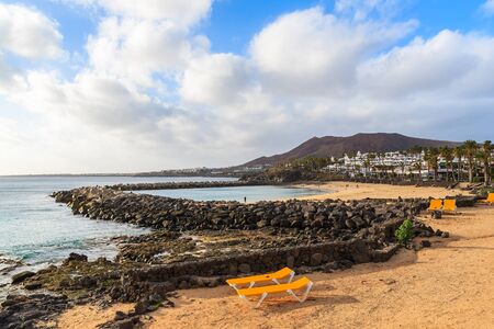 Sunbeds on Playa Blanca beach, Lanzarote, Canary Islands, Spainの写真素材