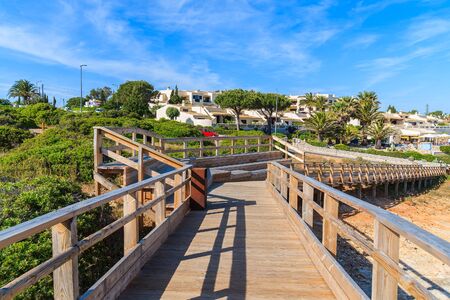 Wooden footbridge from ocean coast to Carvoeiro town, Portugalの写真素材