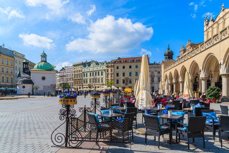 KRAKOW, POLAND - APR 29, 2015: restaurant tables on main market square of Krakow city. More than 10 Million tourists visit the cのeditorial素材