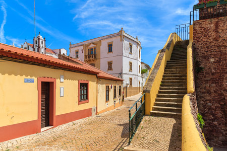 SILVES TOWN, PORTUGAL - MAY 17, 2015: narrow street in old town of Silves with colorful houses.のeditorial素材