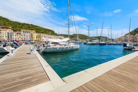 BONIFACIO, CORSICA ISLAND - JUN 23, 2015: sailing boats in Bonifacio port. This town is famous for medieval citadel and is veryのeditorial素材