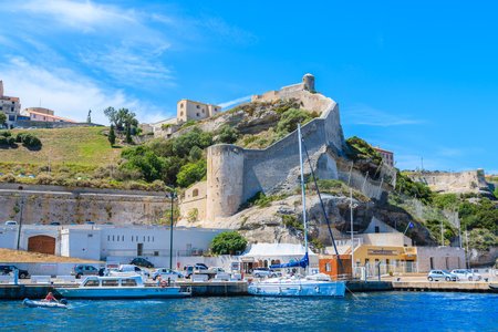 BONIFACIO PORT, CORSICA ISLAND - JUN 25, 2015: boats anchoring in Bonifacio port with citadel building in background. Bonifacioのeditorial素材