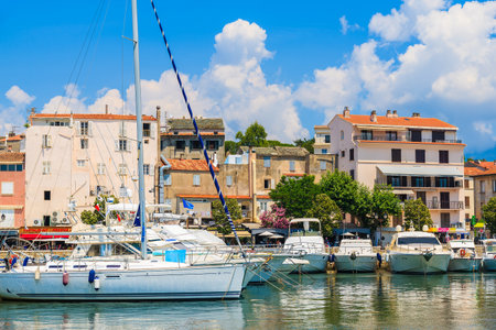 SAINT FLORENT, CORSICA ISLAND - JUN 30, 2015: sailing boats in small fishing port of Saint Florent, Corsica island, France.のeditorial素材
