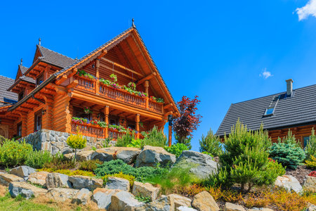 TATRA MOUNTAINS, SLOVAKIA - JUN 13, 2015: typical wooden house in Zdiar village. Many people build houses in traditional mountaiのeditorial素材