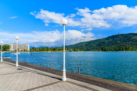 WORTHERSEE LAKE, AUSTRIA - JUN 20, 2015: promenade along Worthersee lake shore during summer time, Austria.のeditorial素材