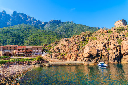 PORTO, CORSICA ISLAND - JUN 27, 2015: boat in Porto bay in early morning. Porto is a small village to the west of Corsicaのeditorial素材