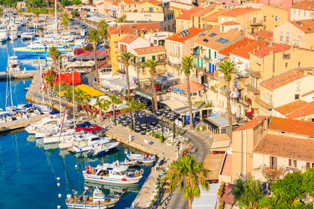CALVI, CORSICA ISLAND - JUN 29, 2015: view of boats and colorful houses in Calvi port. This town has luxurious marina and is verのeditorial素材