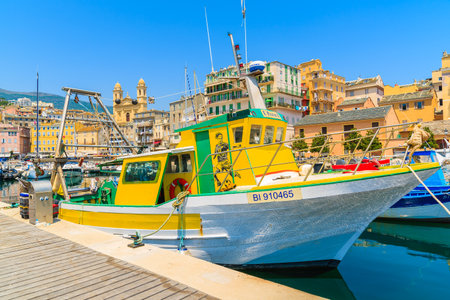 BASTIA PORT, CORSICA ISLAND - JUL 4, 2015: colorful fishing boat in Bastia harbour on sunny summer day, Corsica island, France.のeditorial素材