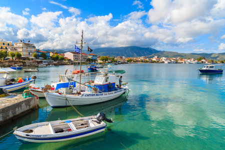 SAMOS ISLAND, GREECE - SEP 23, 2015: colorful fishing boats in small port on coast of Samos island, Greece.のeditorial素材