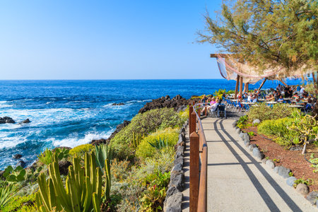 BUENAVISTA DEL NORTE, TENERIFE, NOV 15, 2015: walkway along Atlantic Ocean to restaurant on coast of Tenerife, Canary Islands, Sのeditorial素材