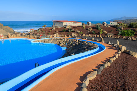 LA PARED, FUERTEVENTURA - FEB 6, 2014: walking alley to swimming pool area in a restaurant in town of La Pared. This area is secluded part of Fuerteventura island.のeditorial素材