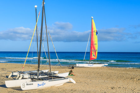 MORRO JABLE, FUERTEVENTURA - FEB 3, 2014: catamaran boats on beach in Morro Jable. This is a popular holiday resort on Fuerteventura island.のeditorial素材