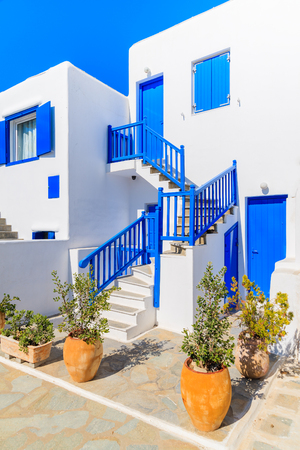Front view of typical white house with blue windows in Mykonos town, Mykonos island, Greeceの写真素材