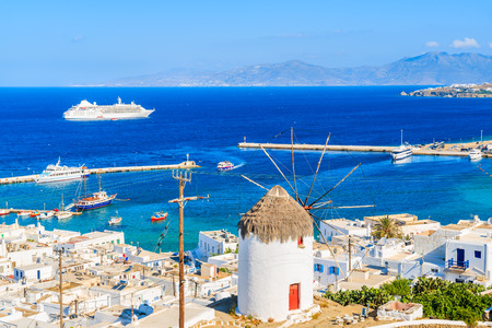 Famous white windmill with red door overlooking Mykonos port, Mykonos island, Greeceの写真素材