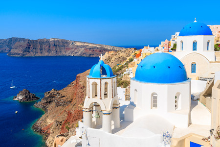 Famous blue domes of white churches in Oia village on Santorini island, Greeceの写真素材