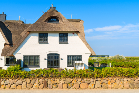 Typical Frisian house in Hornum village on southern coast of Sylt island, Germanyの写真素材