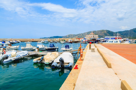 PORTO GIUNCO HARBOUR, SARDINIA - MAY 25, 2014: view of Porto Giunco touristic port with sailboats and yachts mooring, Sardinia island, Italy. Many tourists visit Sardinia island in summer time.のeditorial素材