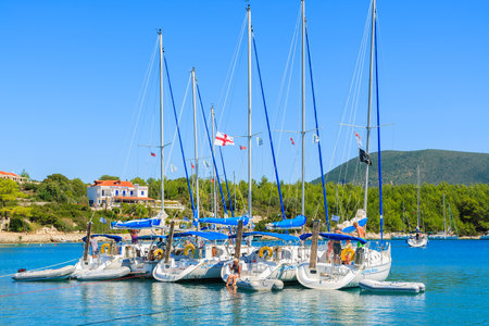 FISKARDO PORT, KEFALONIA ISLAND, GREECE - SEP 16, 2014: Yacht boats in Fiskardo port. Fiskardo is most visited tourist destination on the island and main port for sailboats.のeditorial素材