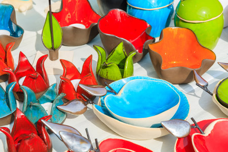 KRAKOW, POLAND - APR 13, 2014: Colourful Easter cups and plates on market stand during festival in Krakow, Poland. Annually traditional fair with Easter products takes place on main market square.のeditorial素材