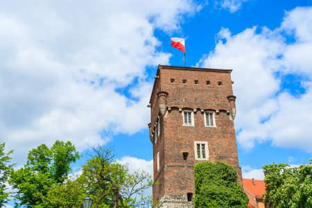 White and red Polish flag on top of Wawel castle tower in Krakow, Polandのeditorial素材