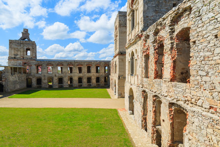 Green lawn courtyard with towers of medieval castle Krzyztopor in spring, Ujazd, Polandのeditorial素材