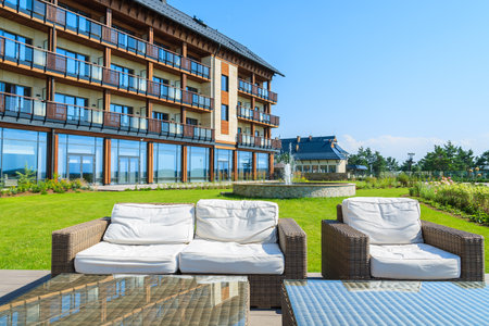 ARLAMOW HOTEL, POLAND - AUG 3, 2014: sofa and coffee table on sun terrace in Arlamow Hotel. This luxury resort was owned by Poland's government and is located in Bieszczady Mountains.のeditorial素材