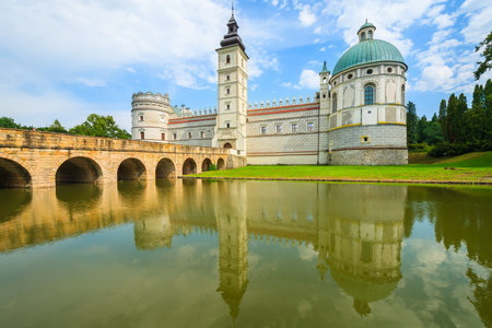 Reflection of beautiful Krasiczyn castle in a lake on a sunny summer day, Polandのeditorial素材