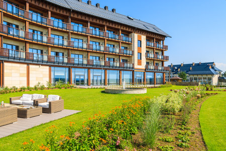 ARLAMOW HOTEL, POLAND - AUG 3, 2014: green garden in Arlamow Hotel. This luxury resort was owned by Poland's government and is located in Bieszczady Mountains.のeditorial素材