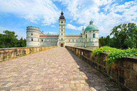 Entrance over a bridge to beautiful Krasiczyn castle on a sunny summer day, Polandのeditorial素材