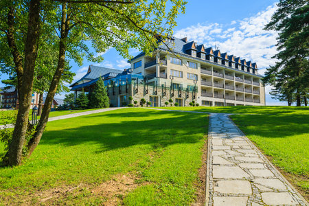 ARLAMOW HOTEL, POLAND - AUG 3, 2014: beautiful hotel building on sunny summer day in Arlamow Hotel. This luxury resort was owned by Poland's government and is located in Bieszczady Mountains.のeditorial素材